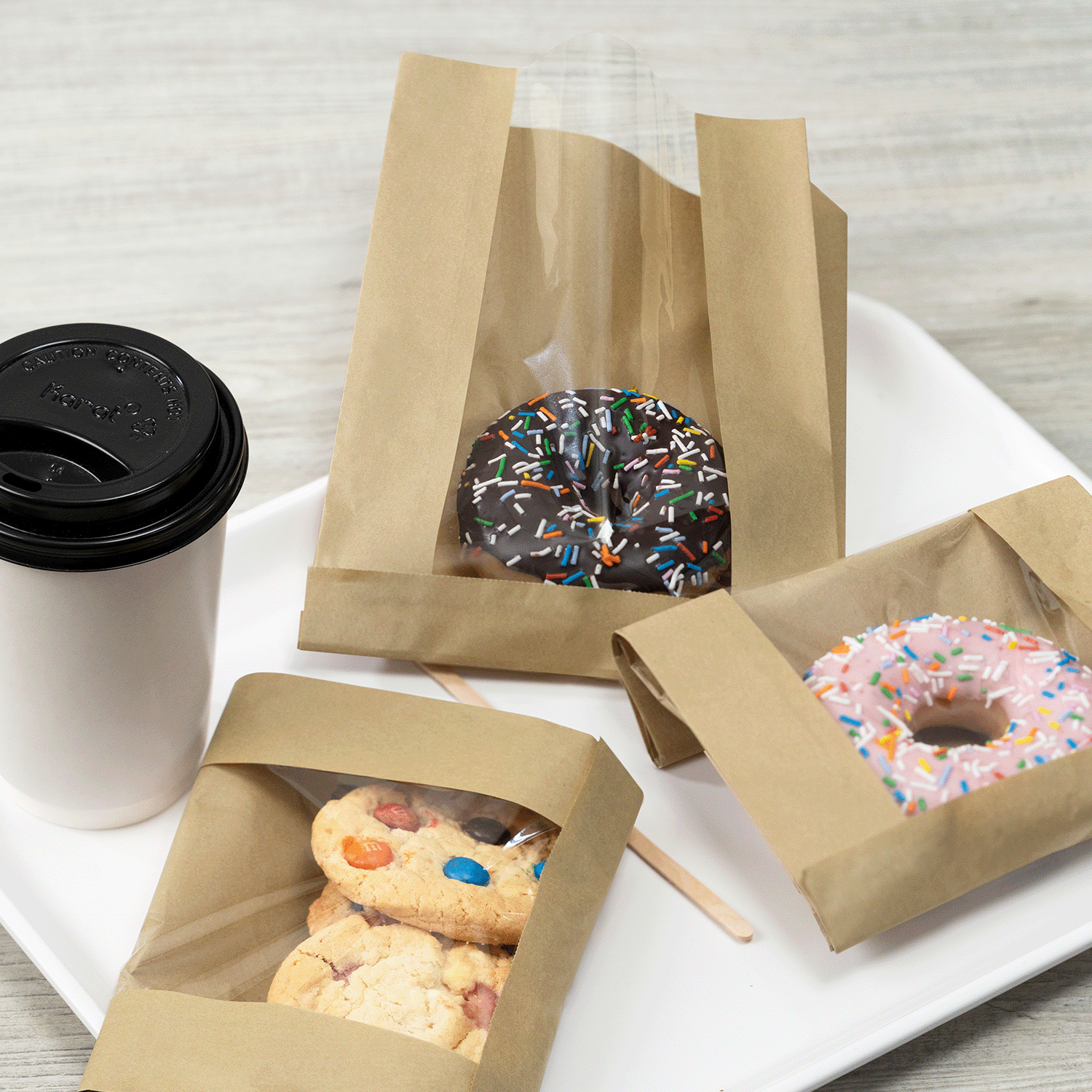 Kraft paper pastry bag with clear window holding baked goods, 1000 ct case